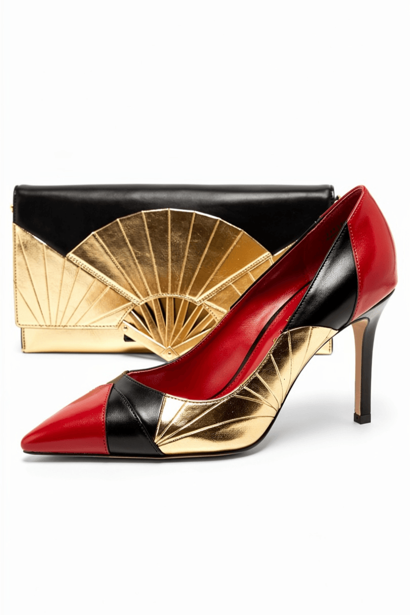Coordinated matchday fashion set featuring black, red and gold high‑heeled pumps paired with a matching clutch with geometric metallic accents.