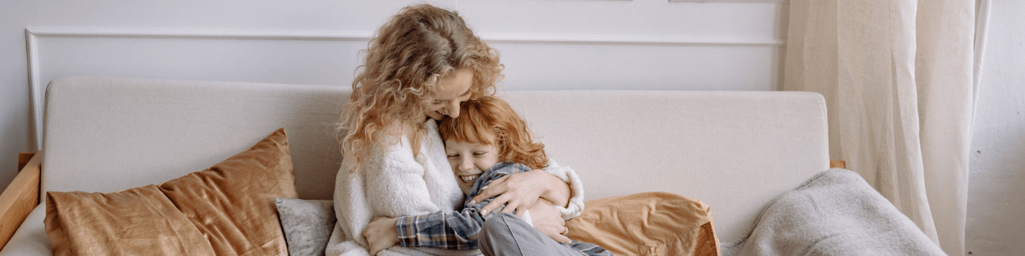 mother kissing her boy child