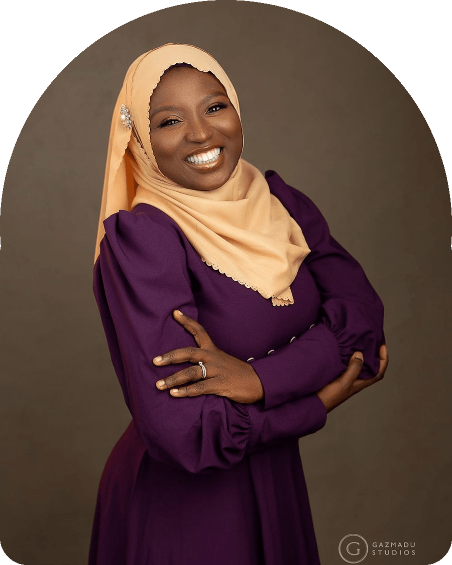 Zuliat Lawal smiling with her arms folded