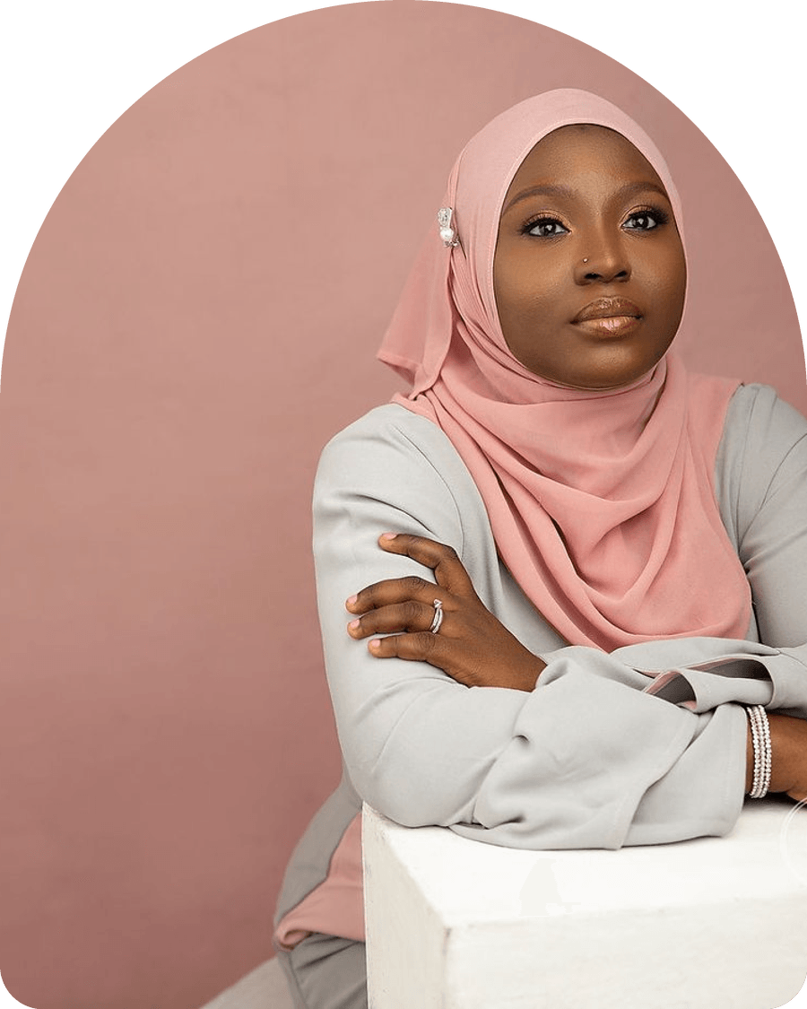 Zuliat Lawal leaning on a white block