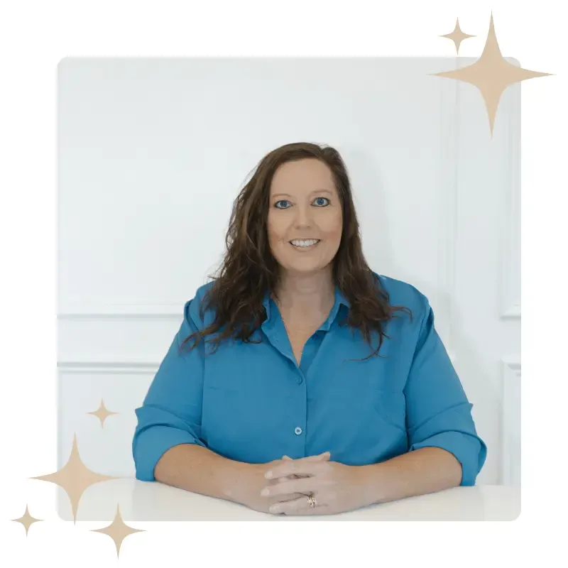 A professional portrait of LaShall Dodson, a consultant in a blue shirt, framed with decorative sparkles, representing the initial assessment phase of business growth consulting.