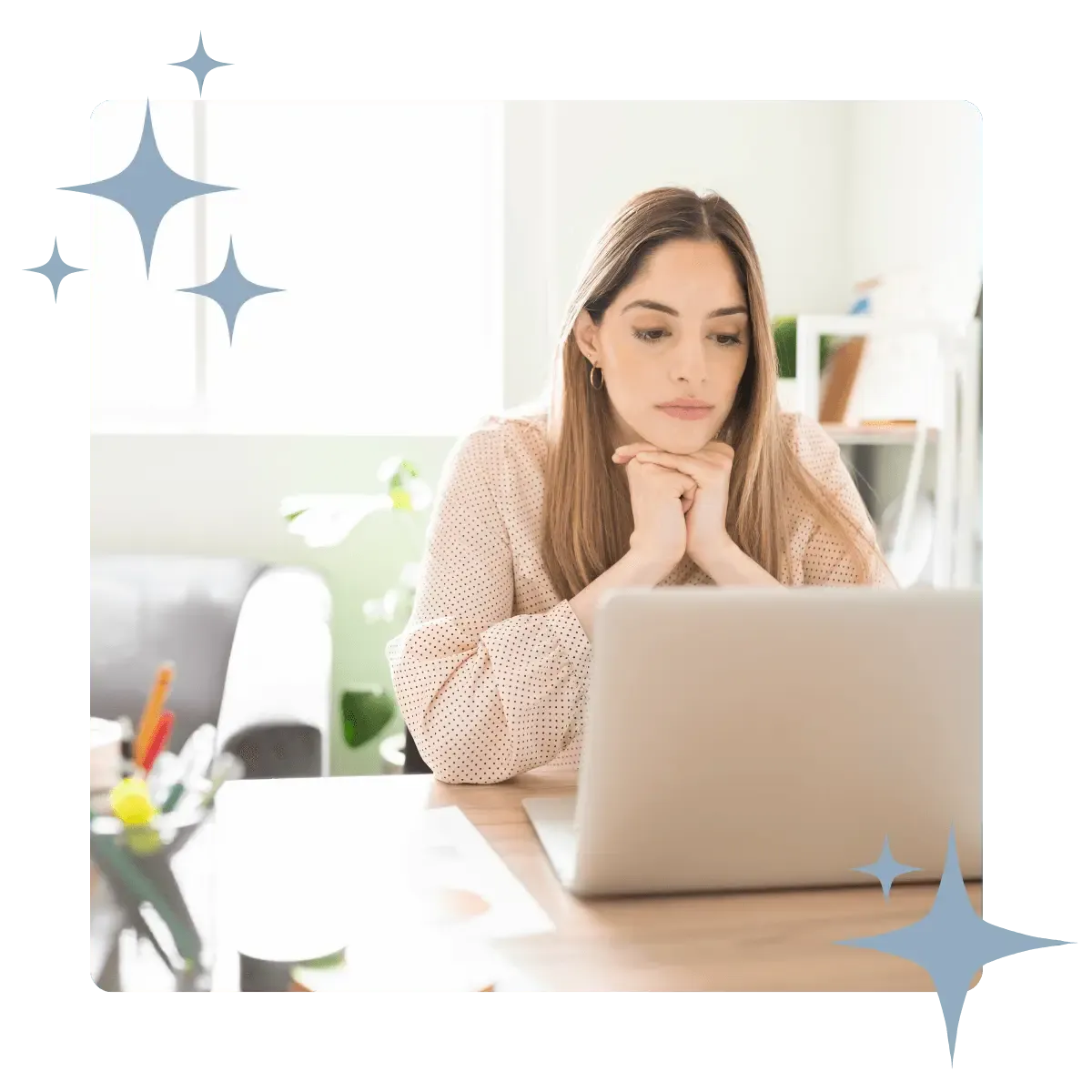 Professional at a desk focusing on a laptop, representing the detailed research phase of comprehensive business growth consulting.