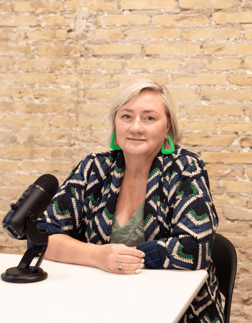Tasch Turner at a desk in front of a microphone