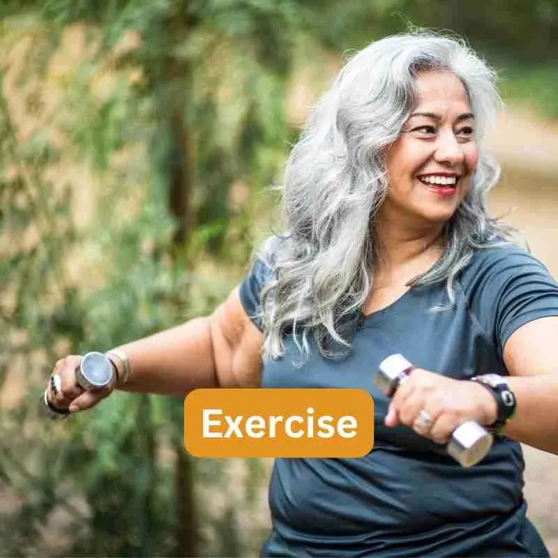 Middle-aged woman exercising with dumbbells