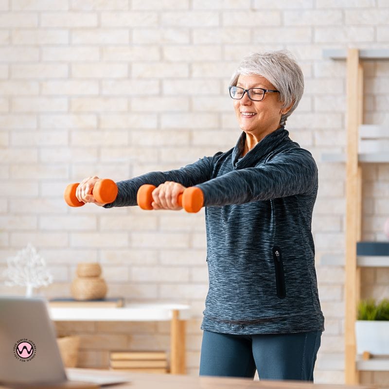 Set a regular times for exercising- woman lifting dumbbells