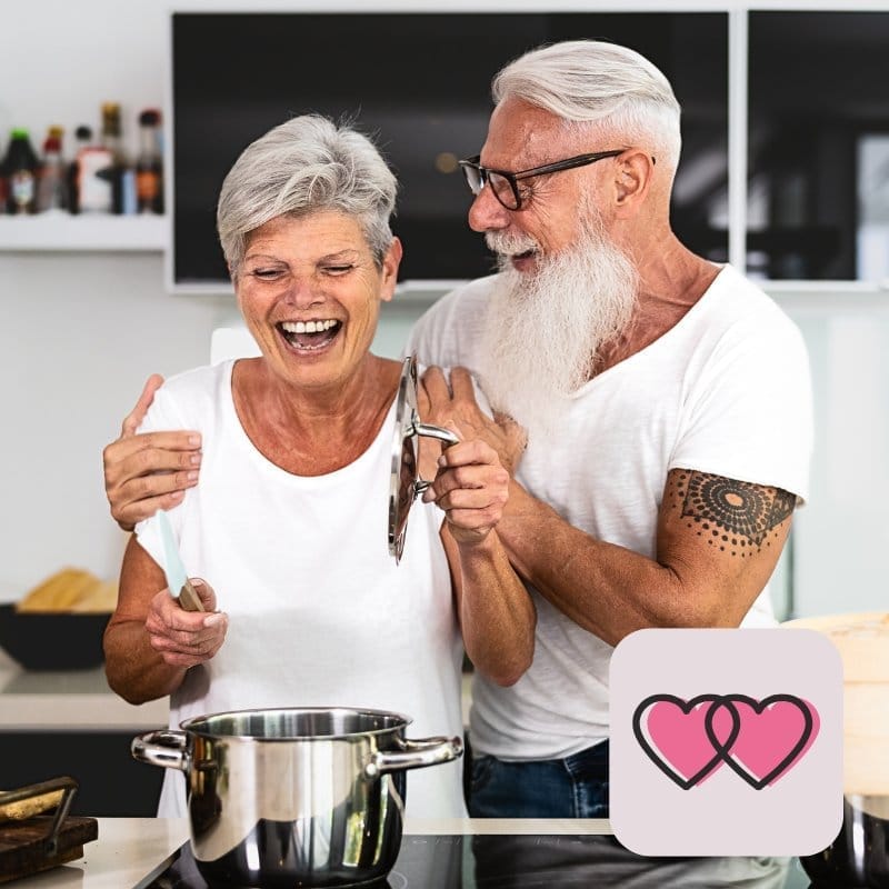 A loving touch brings emotional closeness - man touching partner lovingly in the kitchen