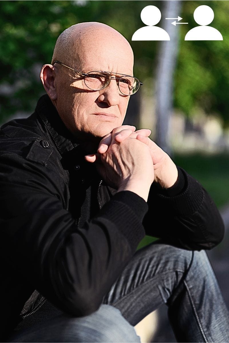 Middle-aged man looking grumpy - misinterpretation of body language