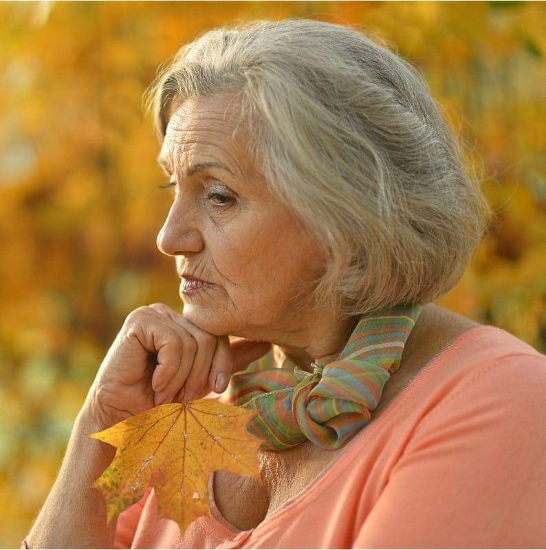 Middle aged woman in thinking mode: empty nester and possibilitiesy