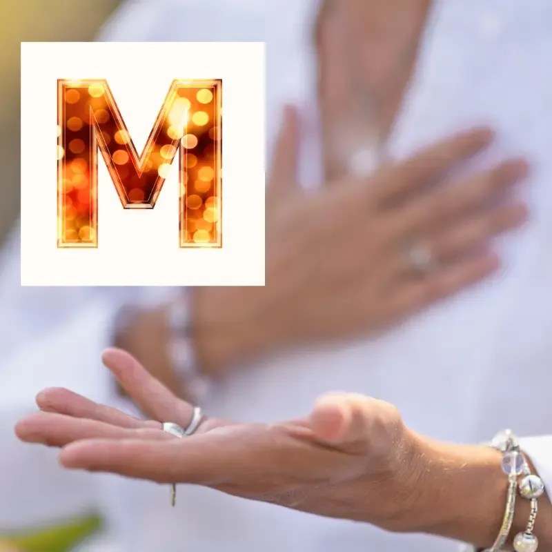 Woman over 50 practicing Mindvalley The M Word meditation to lower cortisol and manage neuroplastic pain.