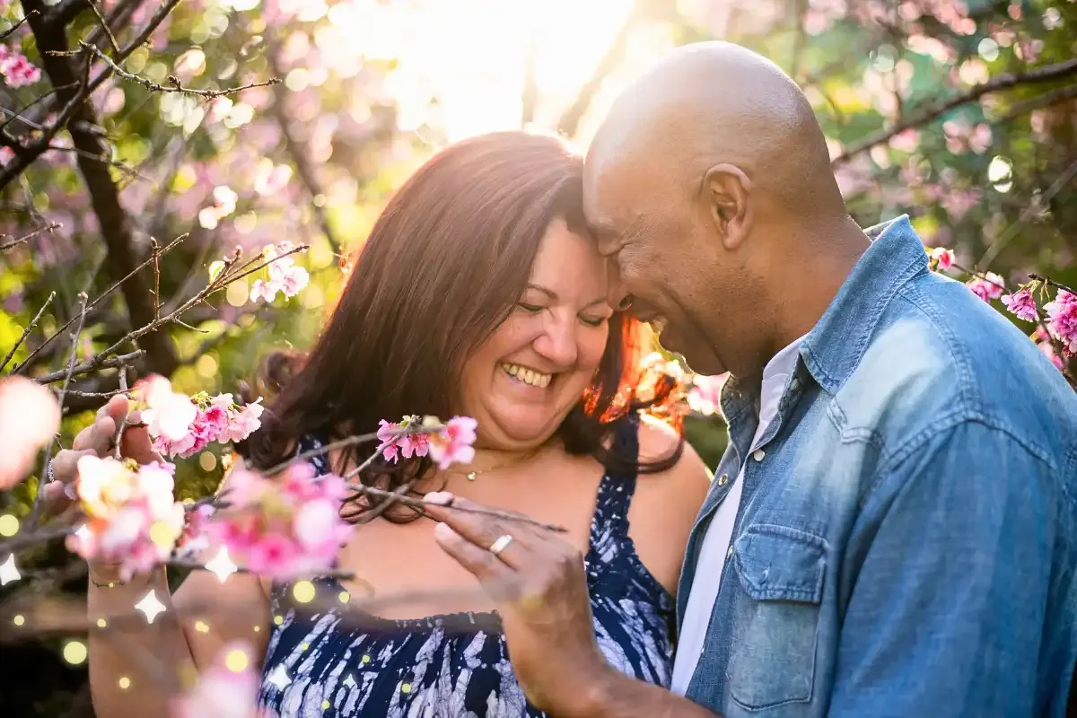 A happy couple in their 60s connecting and laughing together, demonstrating how to protect a marriage from caregiver stress