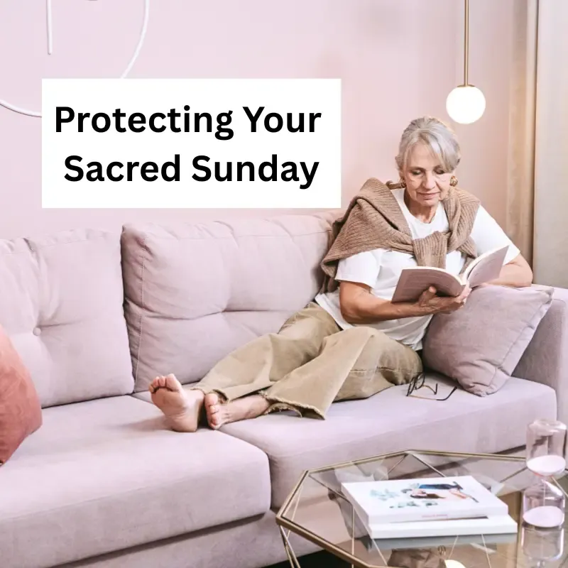 A relaxed woman over 50 sitting on a sofa reading a book to illustrate a Sacred Sunday and setting boundaries with ageing parents.