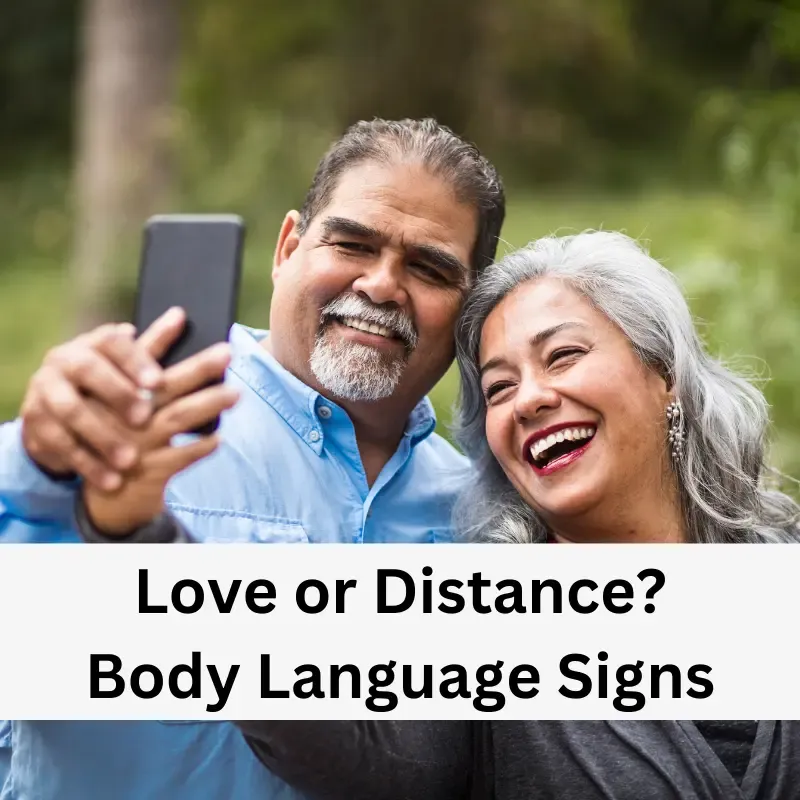 An older couple sitting together, with body language indicating emotional closeness and affection.