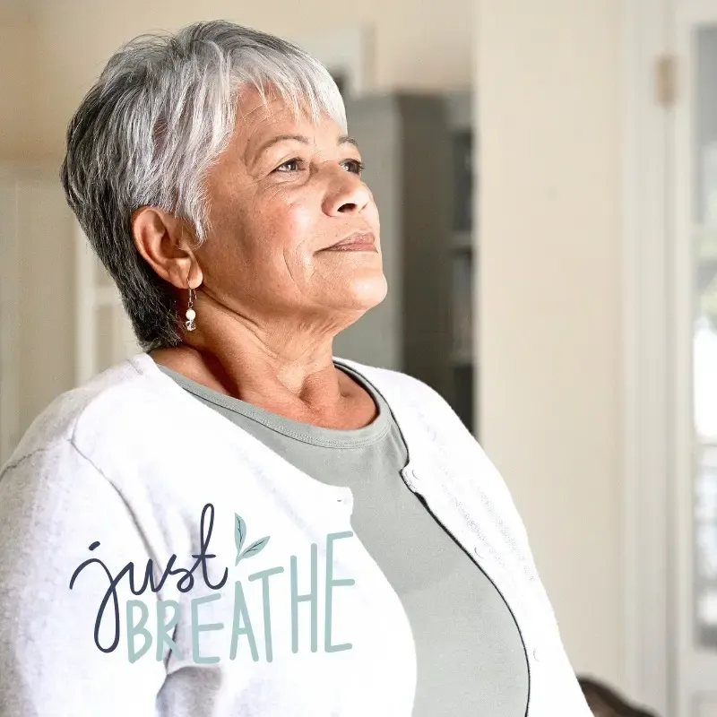 A woman over 50 practicing mindfulness to find calm and steady her mind during the empty nest stage