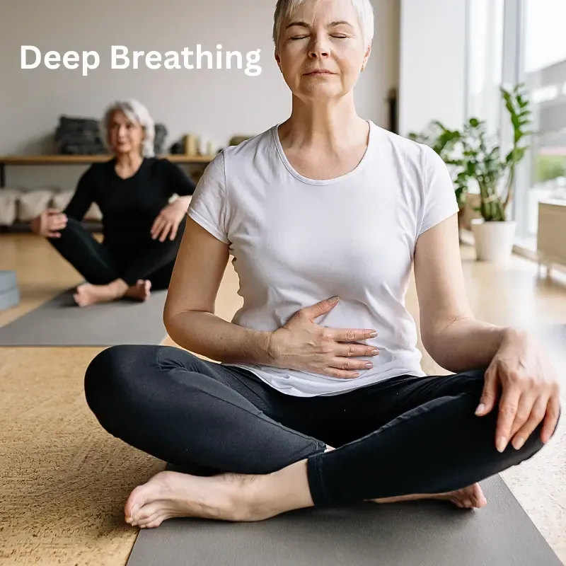 A woman over 50 practicing deep breathing to calm her nervous system and reduce midlife stress