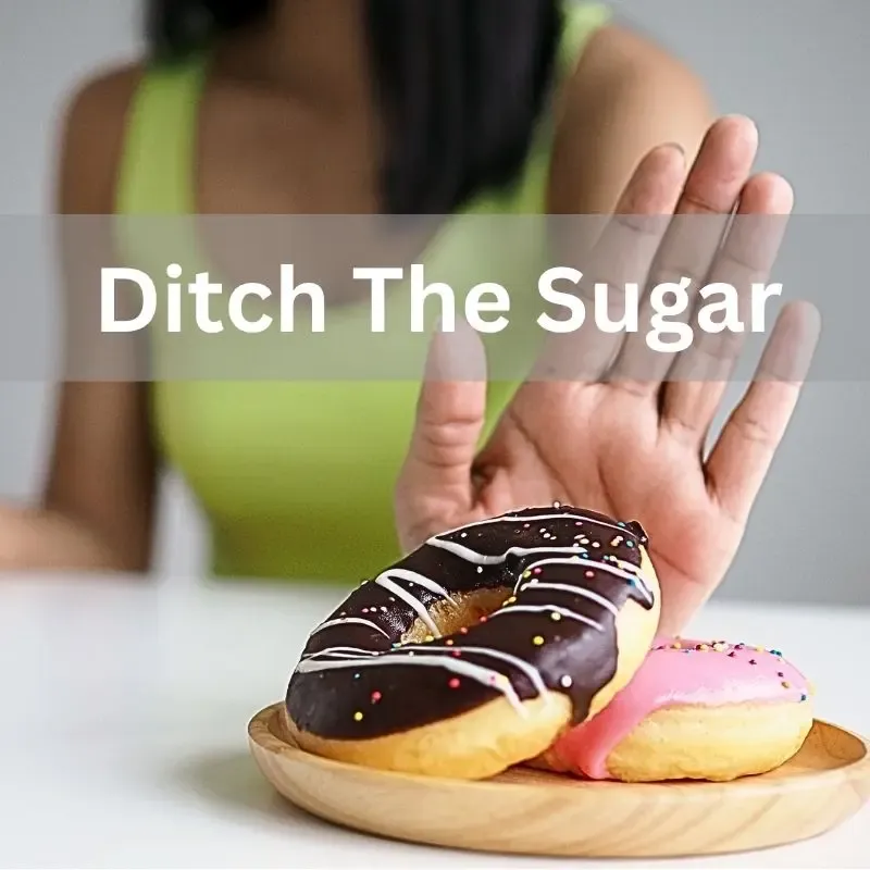 A woman saying no to sugary foods - how to ditch sugar
