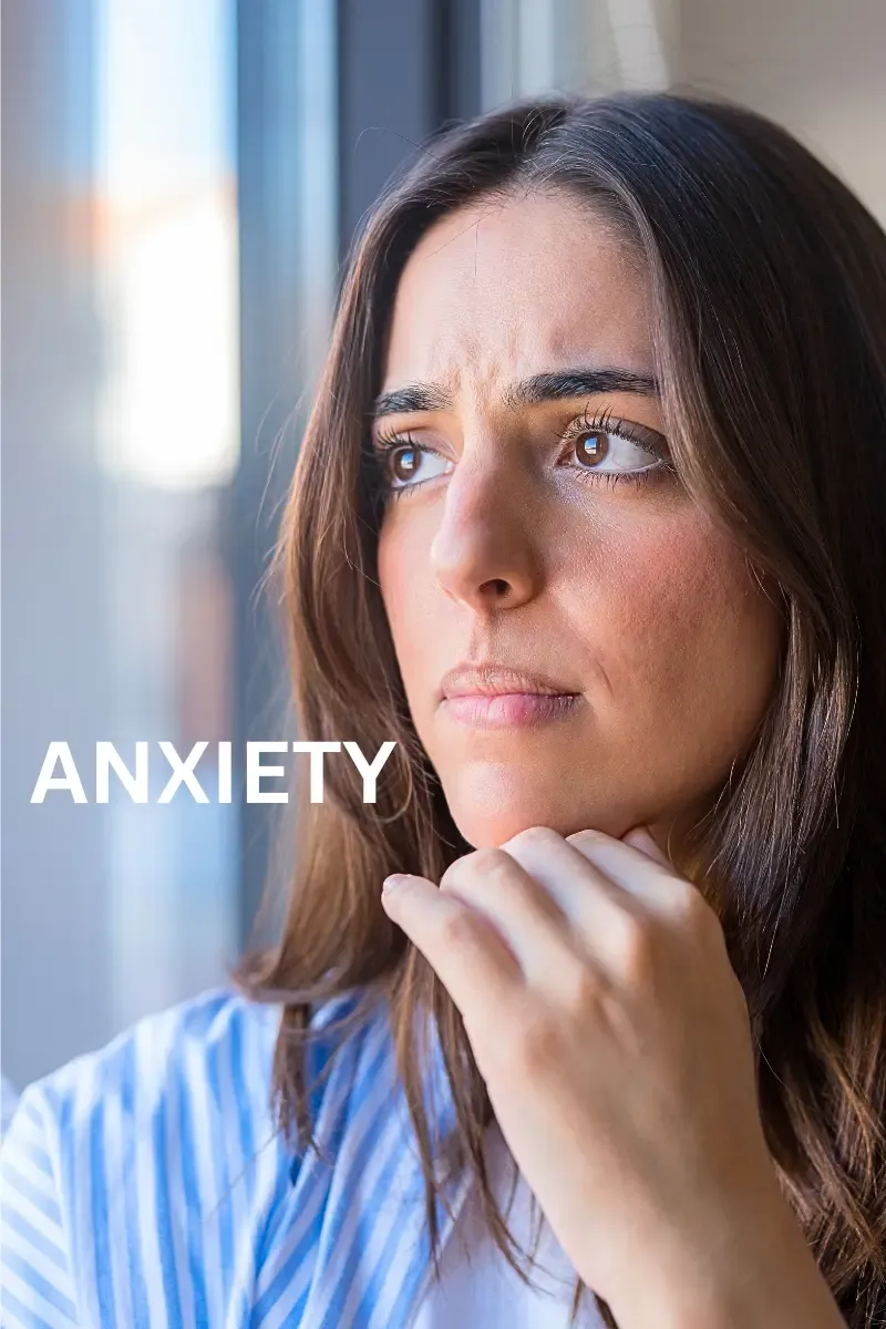 A mature woman over 50 looking overwhelmed and anxious, illustrating the emotional challenges and mental fatigue often linked to menopause.