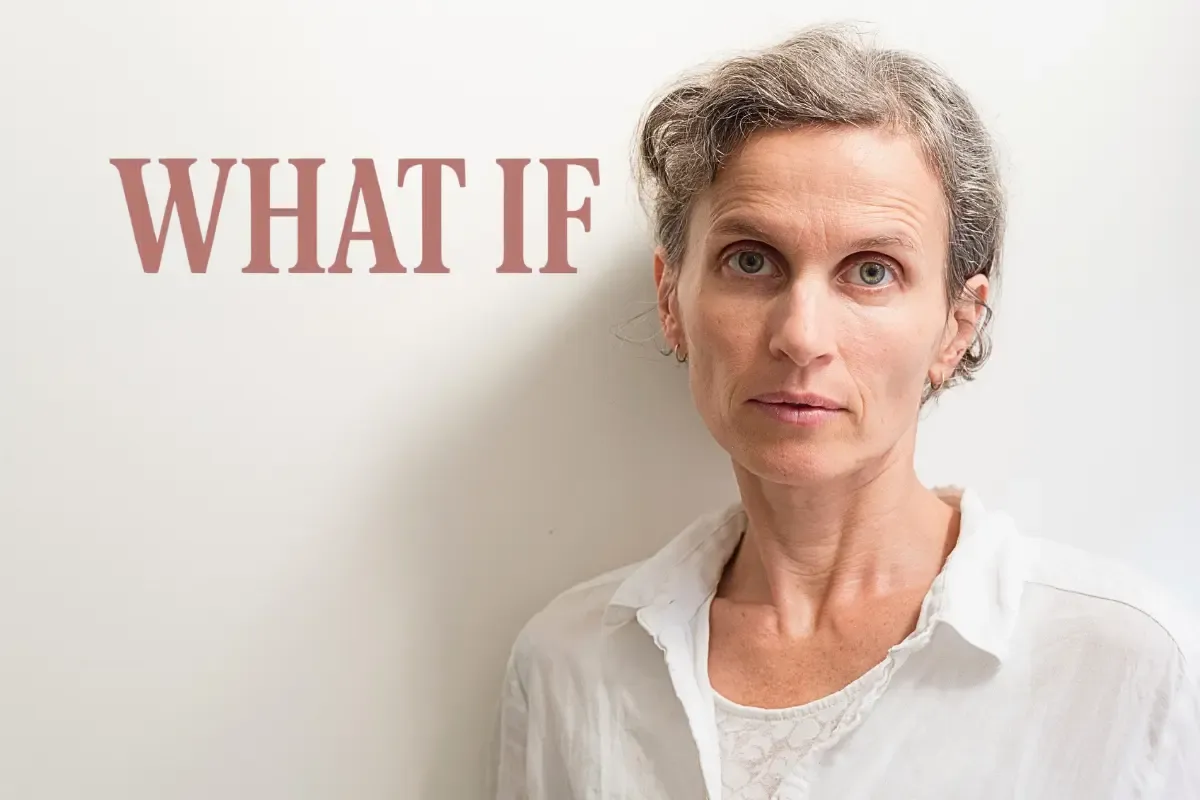 A mature woman over 50 looking worried with 'what if' thoughts