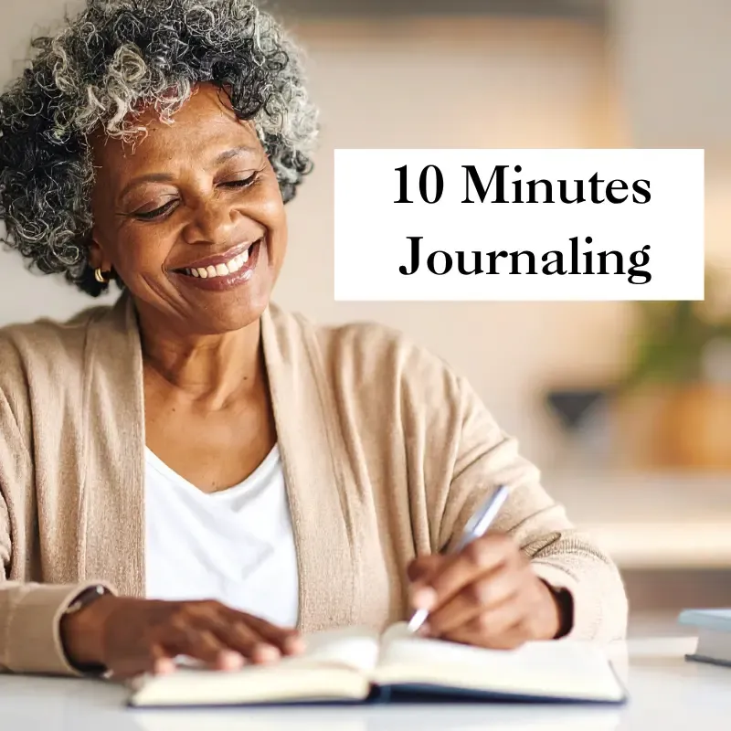A woman journaling about her feelings in her empty nest phase
