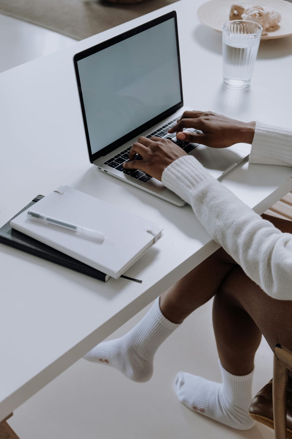 Woman working on a digital product for her online business