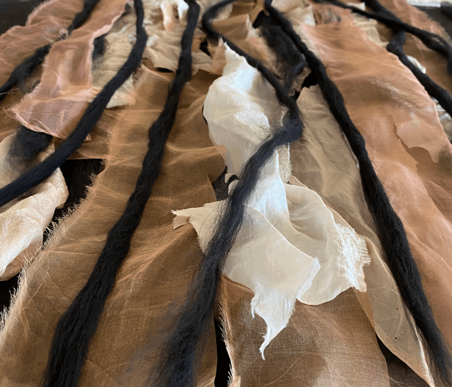 Nuno felting on silk with raw wool organic texture details