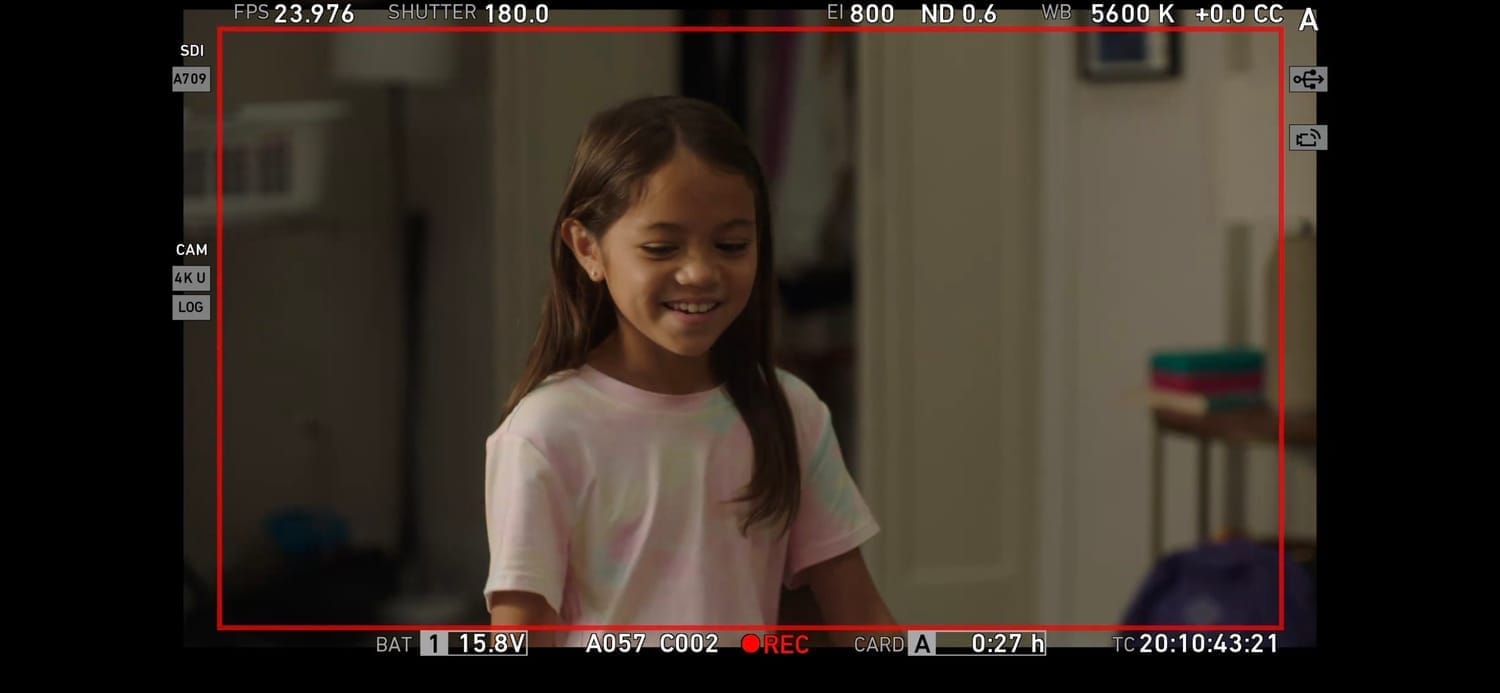 Vanessa Fox smiling on set of Pillow Talk in a tie-dye shirt.