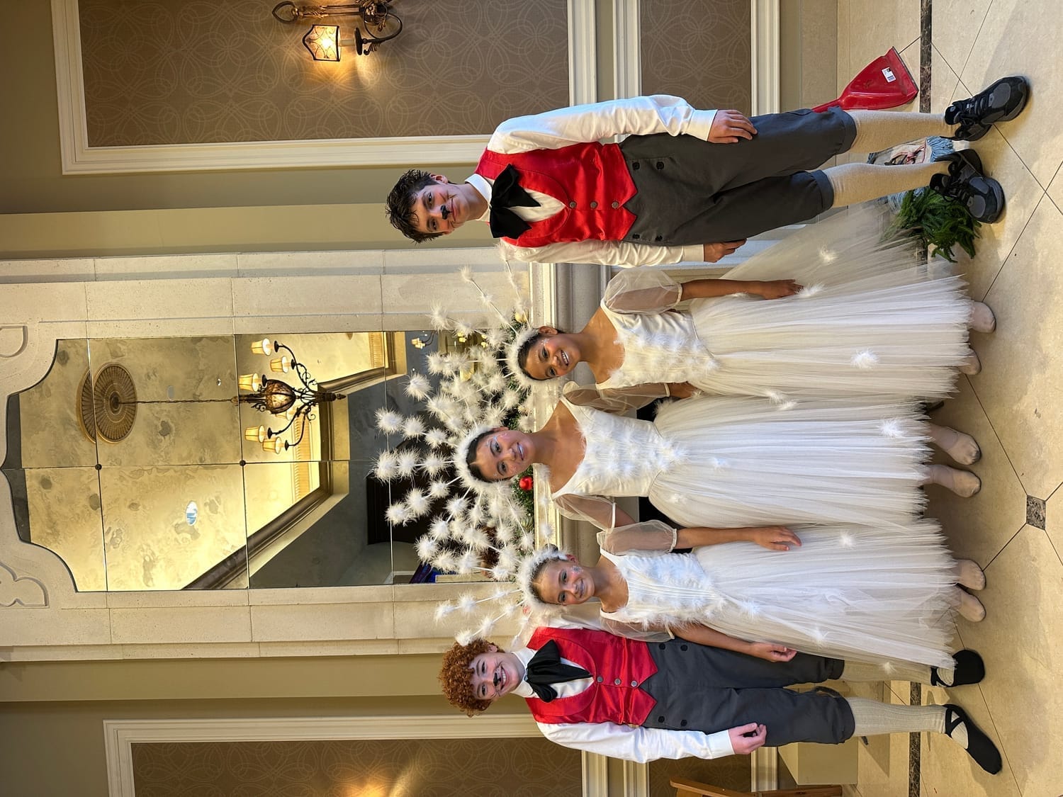 Vanessa Fox with cast members in period costume during Murdoch Mysteries behind-the-scenes moment.