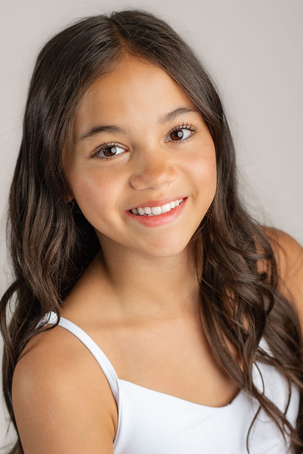 Headshot of Vanessa Fox, ACTRA teen actor, dancer, and model, photographed against a blue background.