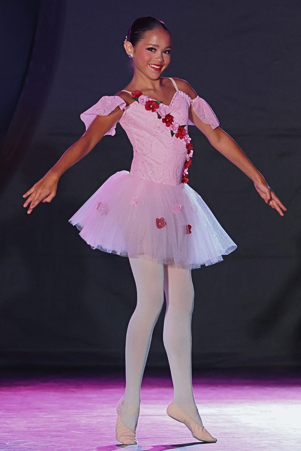 Vanessa Fox performing a ballet solo on stage during a competitive dance performance.