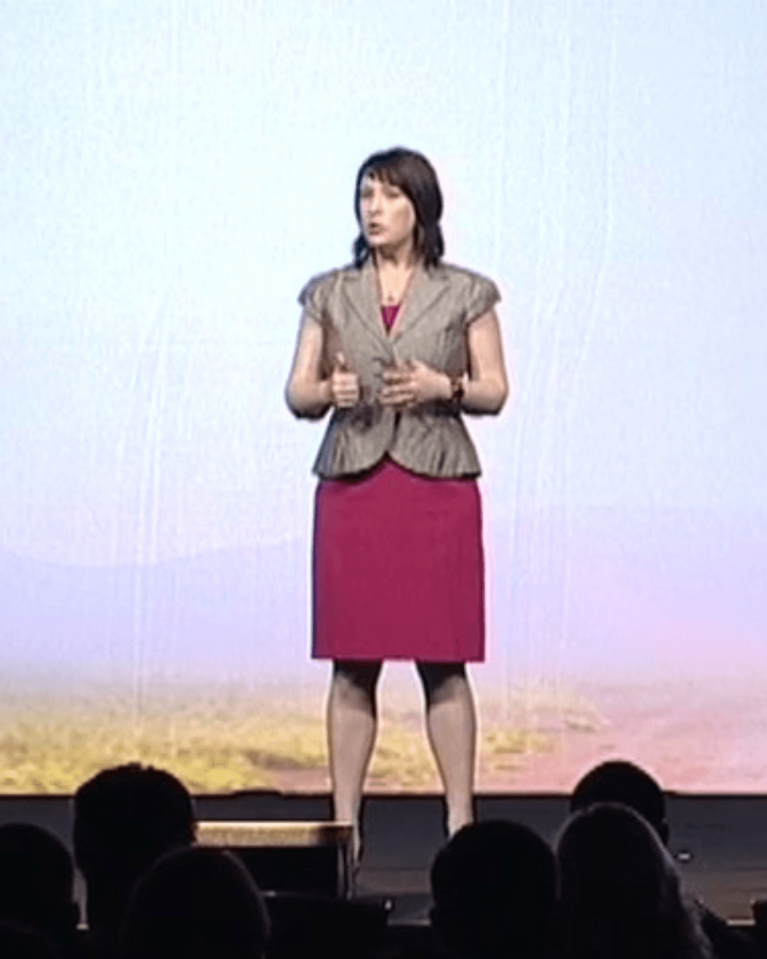 Sarah Cooke speaking on stage about culture change and corporate transformation