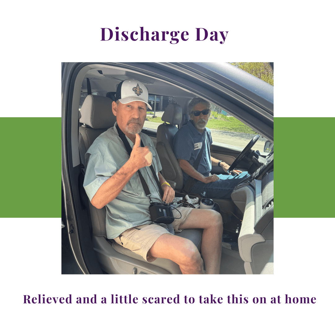 Man sitting in a vehicle after hospital discharge, giving a thumbs up while leaving after two weeks of recovery