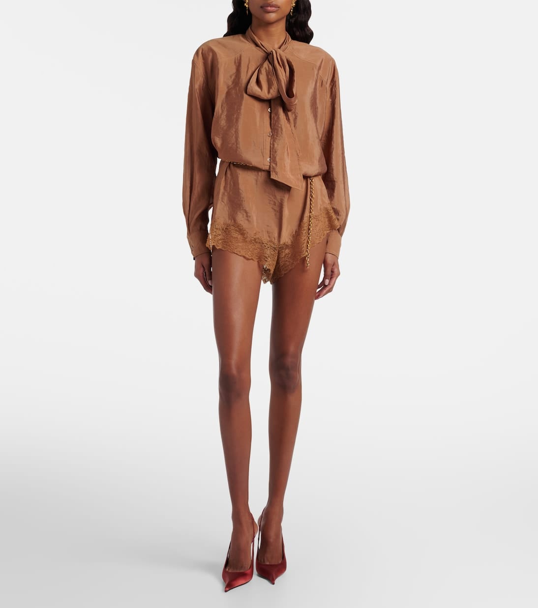 Saint Laurent black halterneck open-back jumpsuit — luxury investment piece women 2026 — quiet luxury fashion — aecreativ.eu
