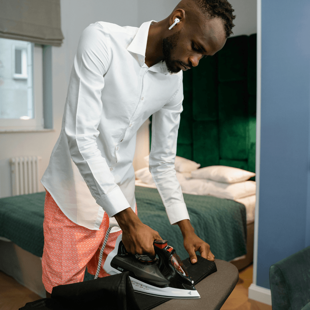 Man listening to audiobook while ironing 