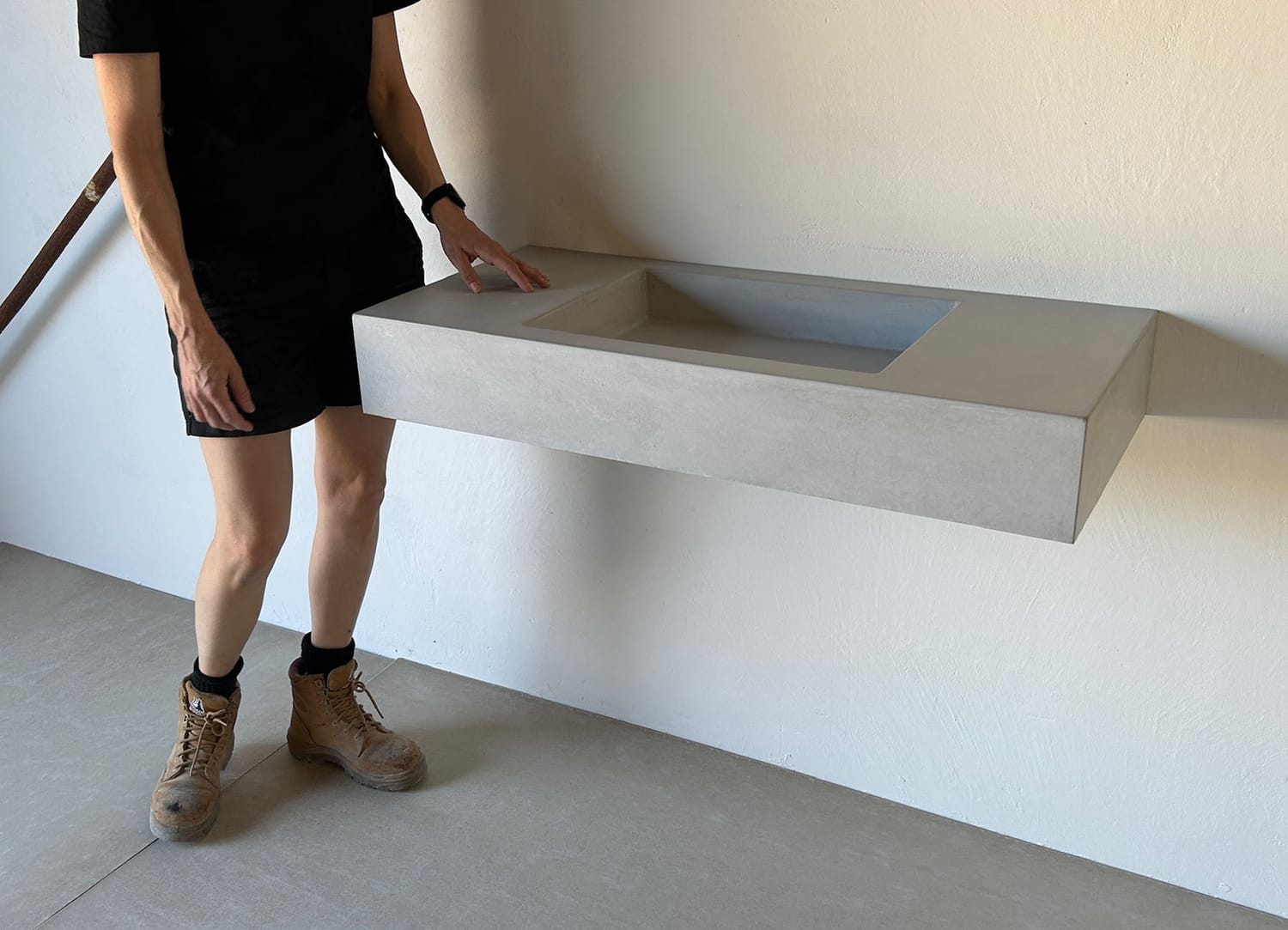 Student standing next to their sink