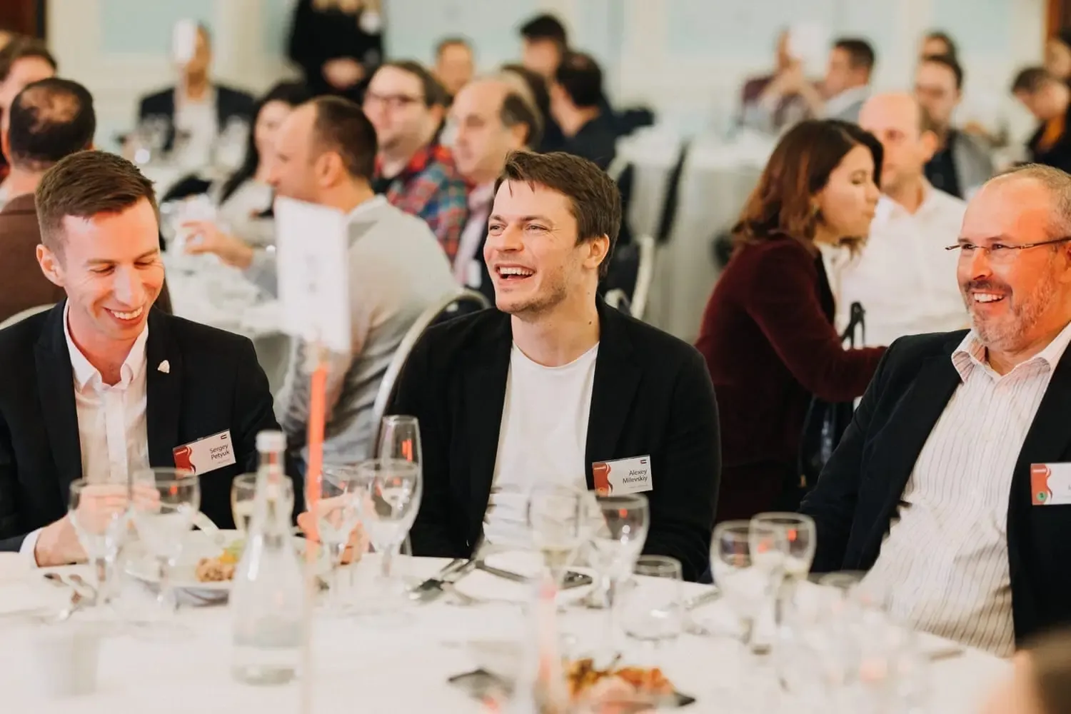 Members networking at an exclusive business dinner