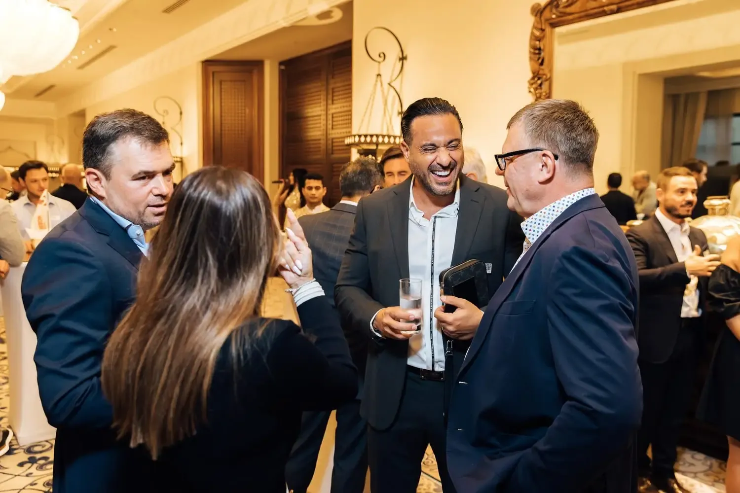 Entrepreneurs connecting at a private business reception