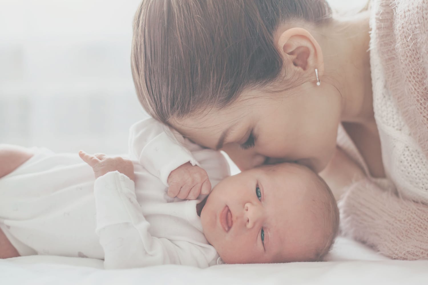 Mother bonding with newborn baby