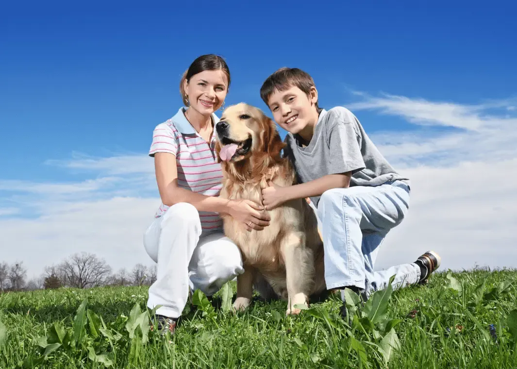 mom and boy with a dog