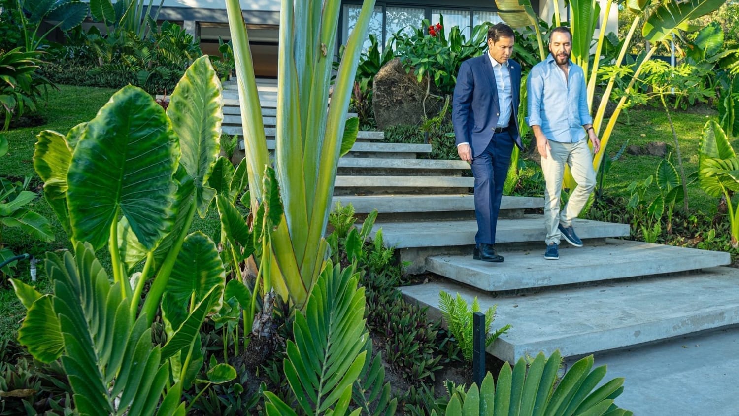 Senator Marco Rubio walks with President Nayib Bukele down garden steps at the presidential residence in El Salvador, highlighting U.S.–El Salvador diplomatic relations and international political cooperation.
