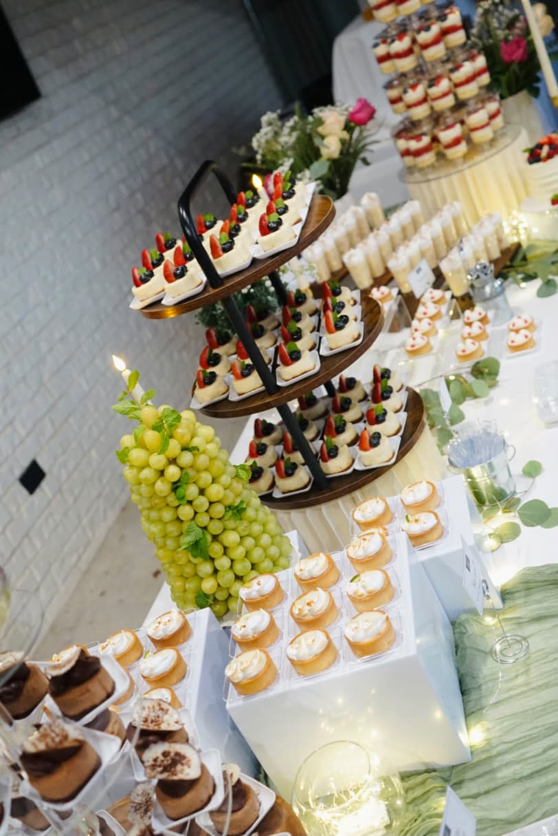 Dessert table with mini tarts and cheesecakes – Sweet Bite Tulsa