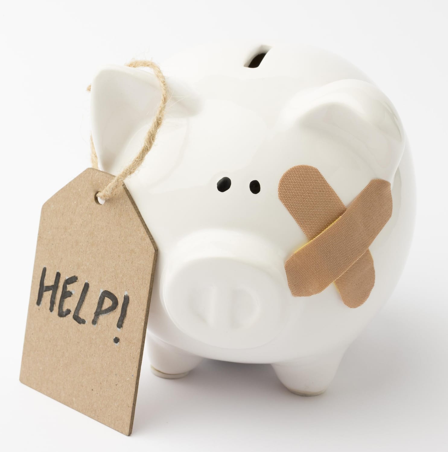 Afbeelding spaarvarken met pleister en help - staan je financiën je vrijheid in de weg?