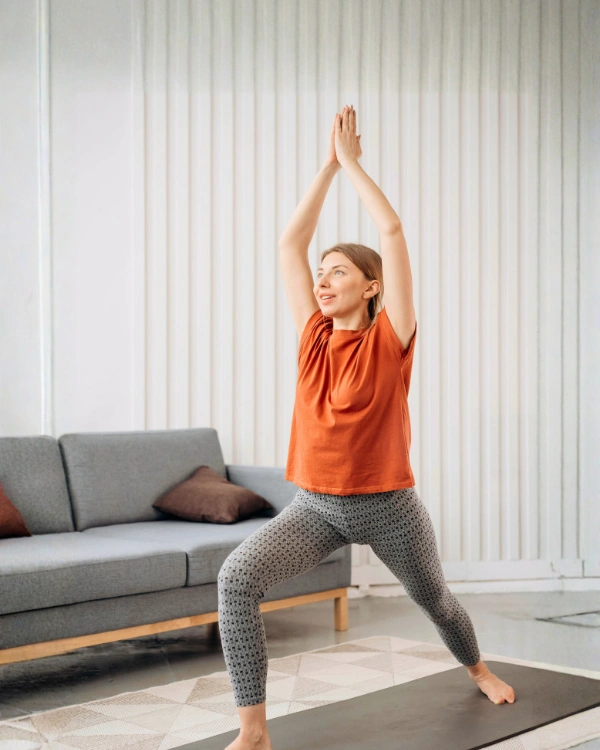 woman doing yoga at home