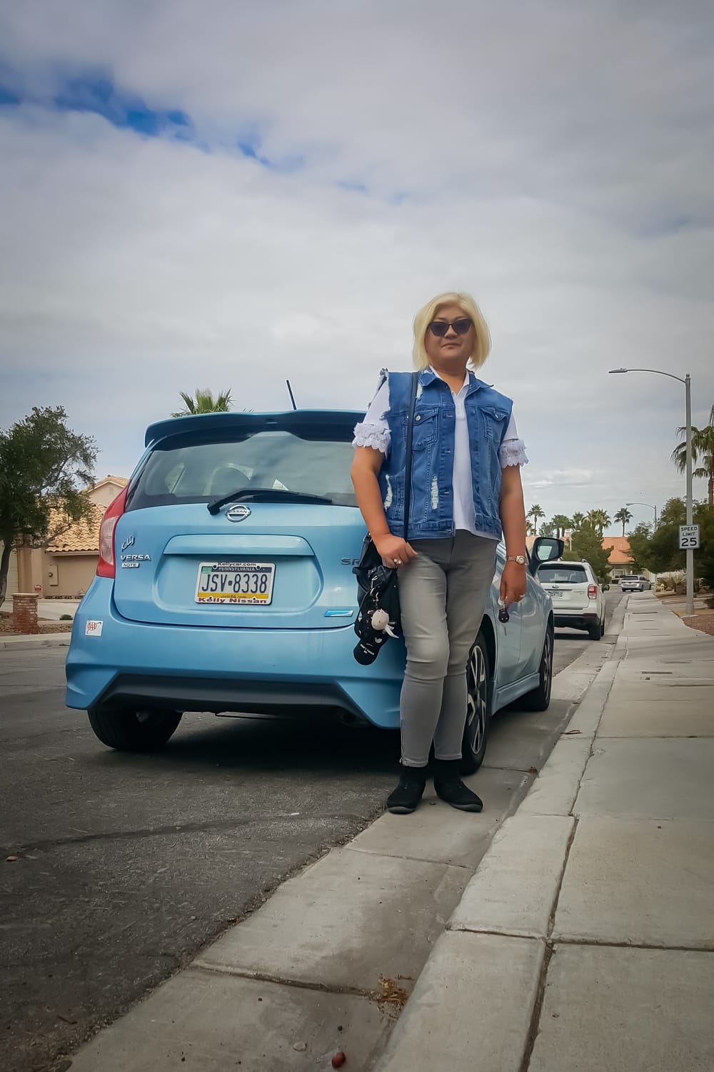Blue Nissan Note with the words "Senior Owned, the Ad Said" beside the author's portrait, introducing a memoir about freedom, family, and saying goodbye to a beloved car.
