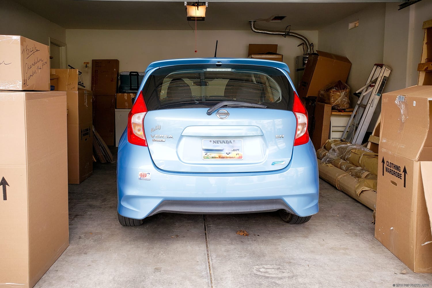 Blue Nissan Note with the words "Senior Owned, the Ad Said" beside the author's portrait, introducing a memoir about freedom, family, and saying goodbye to a beloved car.
