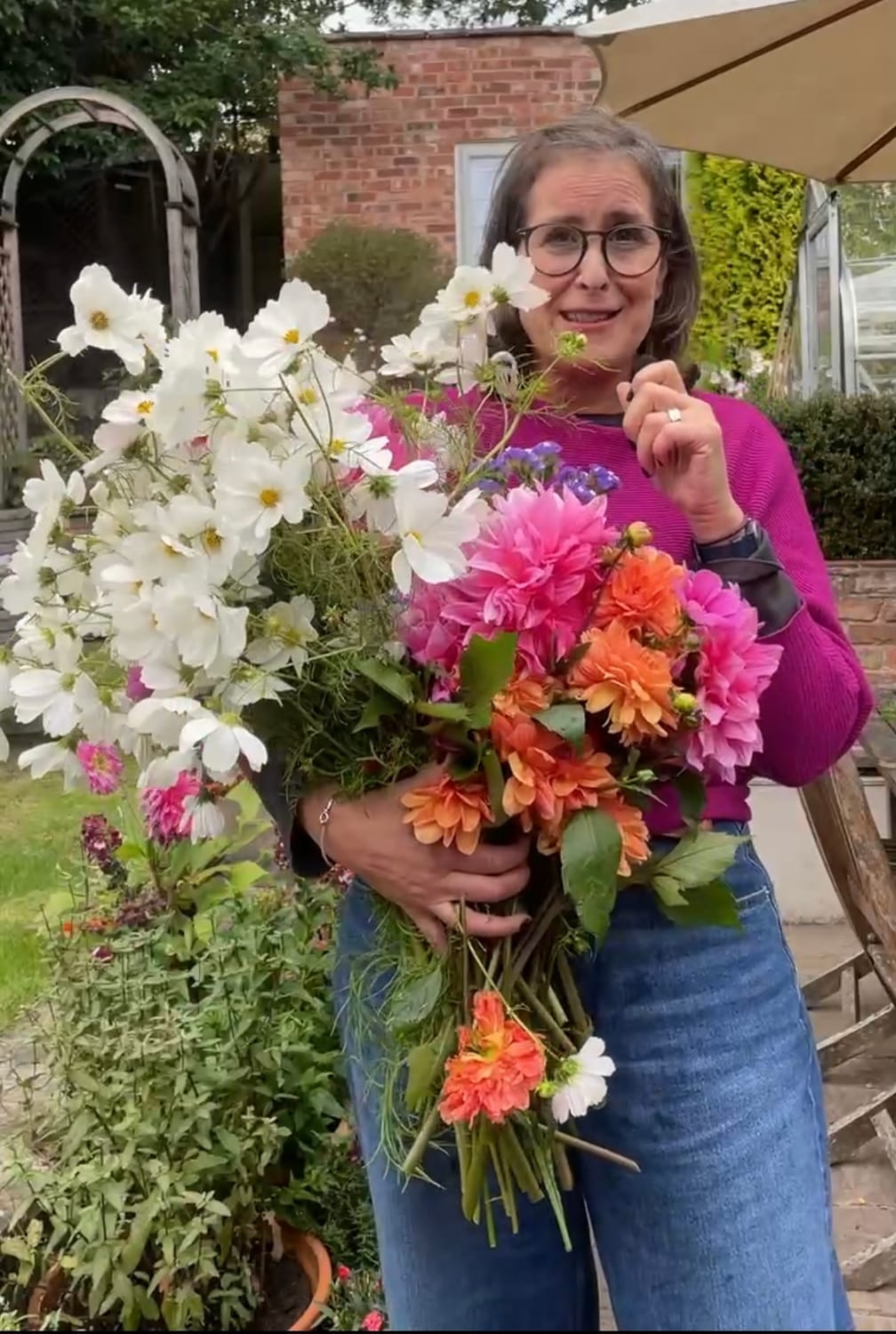 Bridget Rose holidng a large bunch of flowers