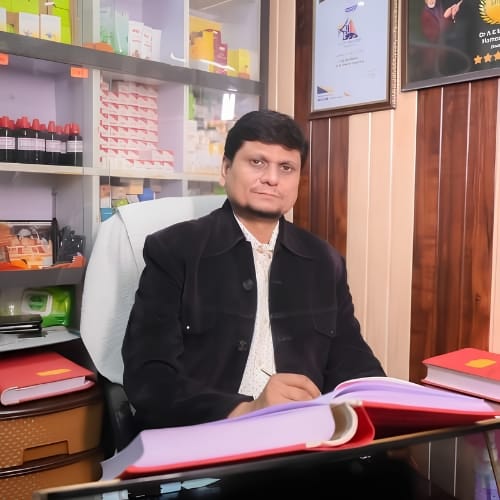 Dr. A. K. Mishra providing personalized homeopathic care