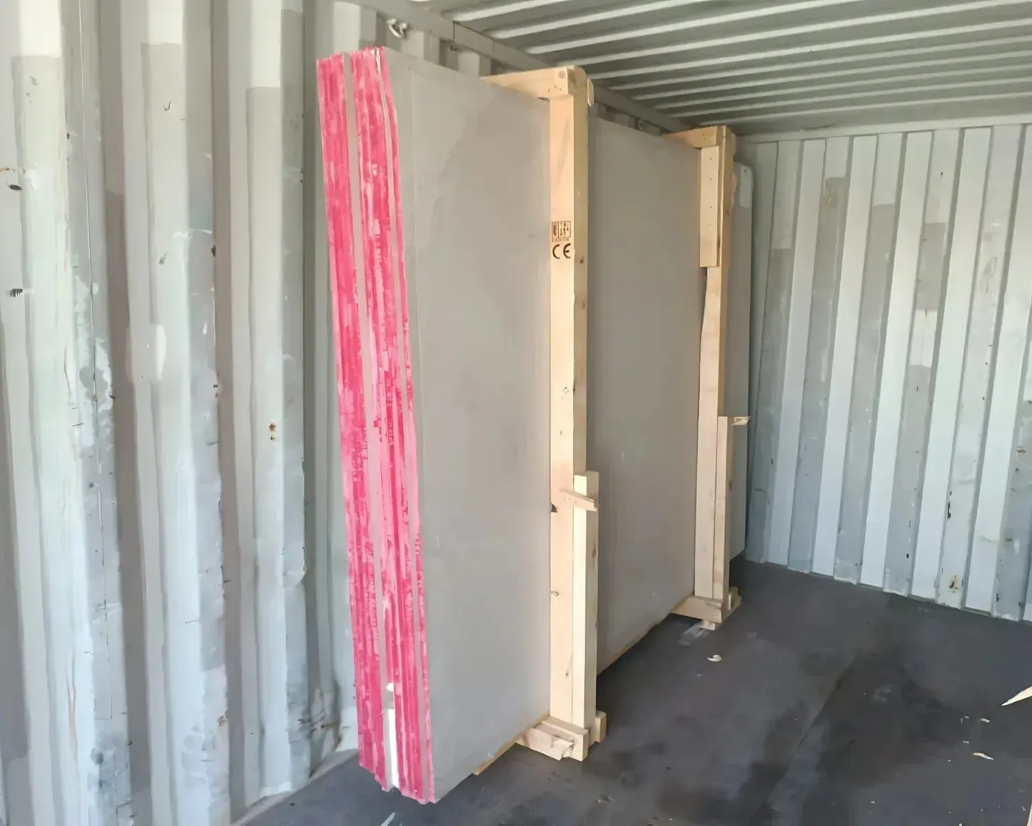Soft Beige slabs fixed to A-frames inside the container