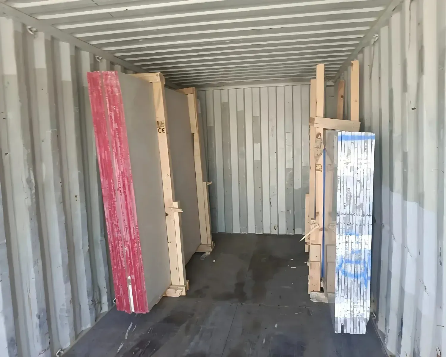 Tiles and slabs spaced and secured along container ribs