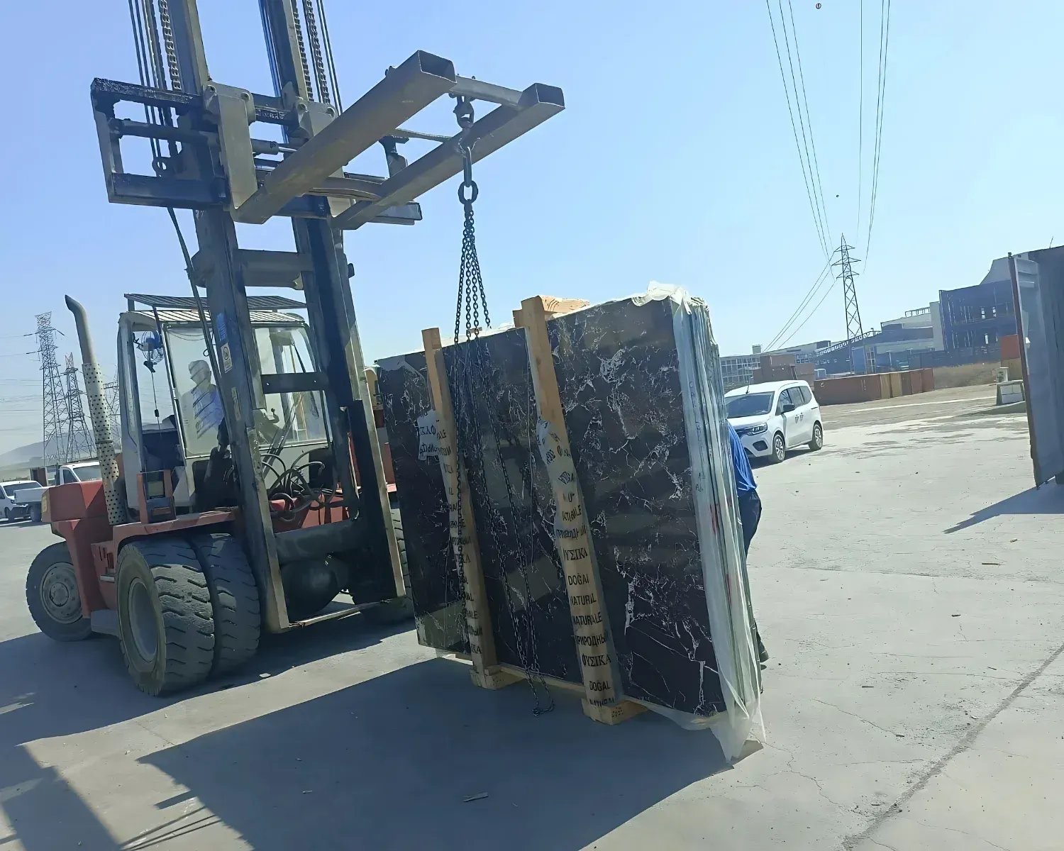 Cross-braced crate fixed with ratchet straps inside container