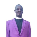 Pastor Johnson A. Baso smiling in a formal portrait
